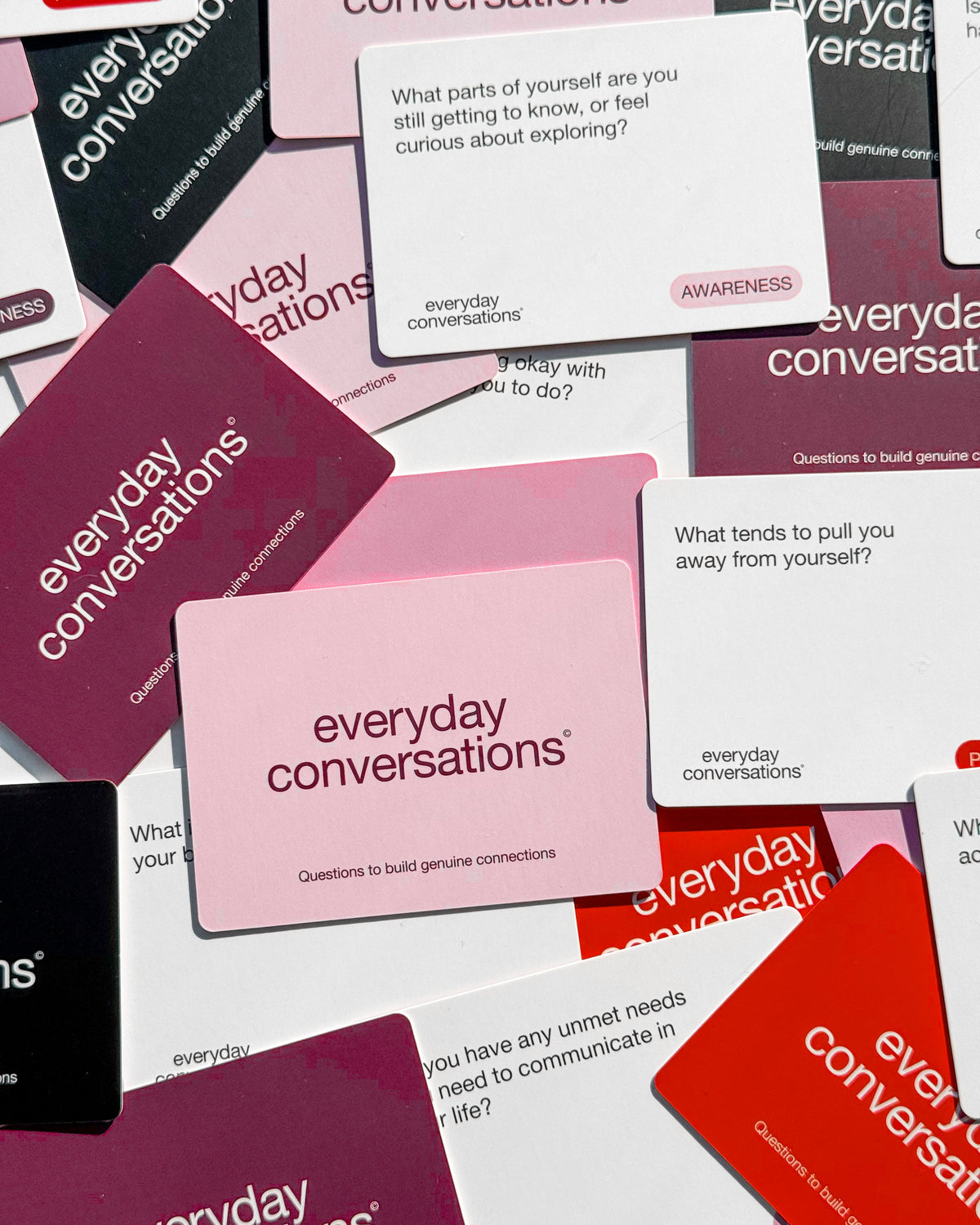 Flat lay of Everyday Conversations Self Love Edition cards showing prompts on awareness, perception and self-reflection